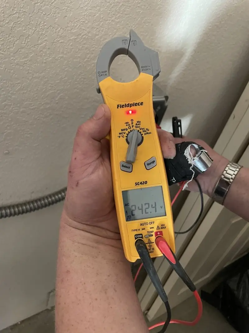 Voltage testing with clamp meter during Aluminum Wiring Replacement in St. Anthony